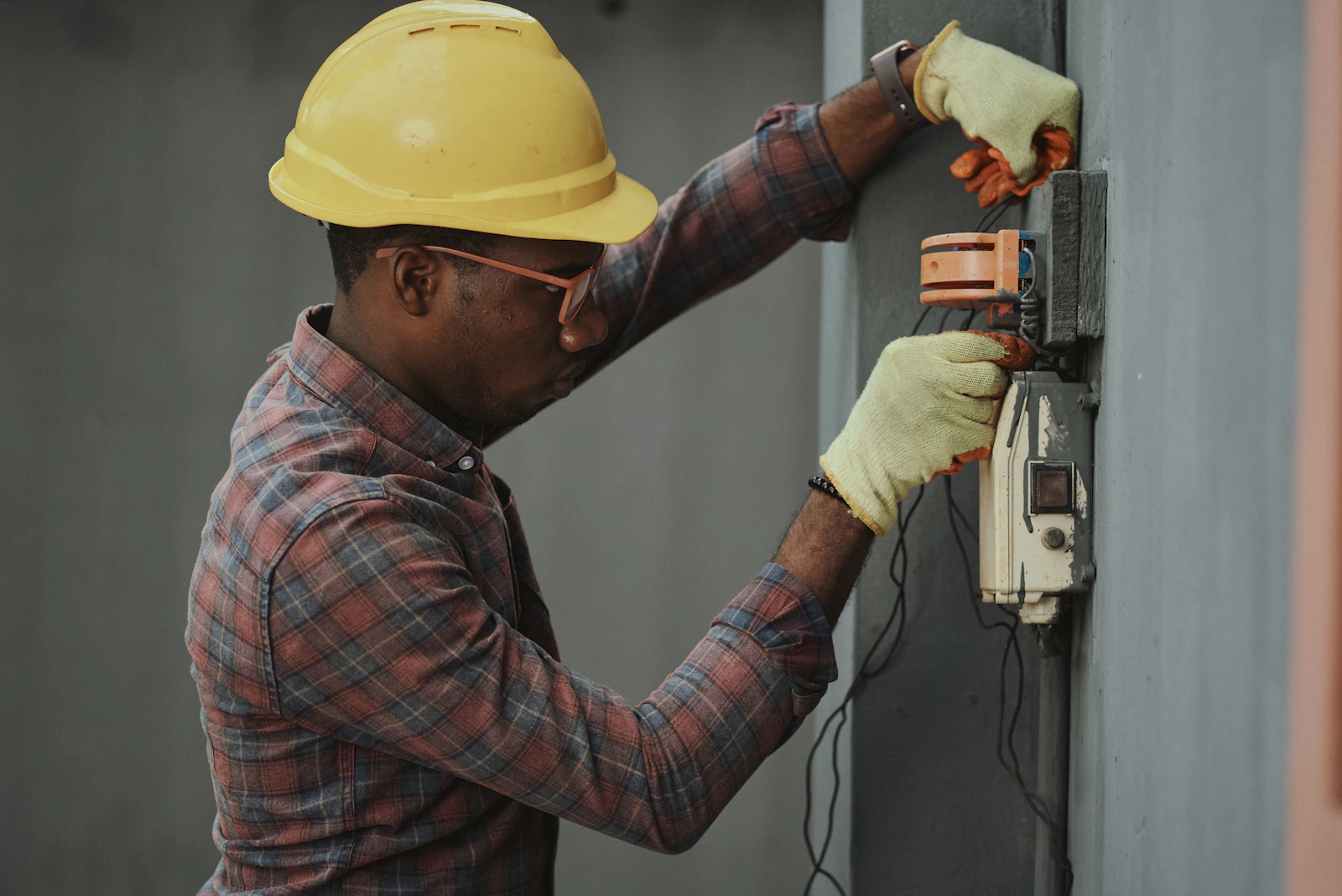 Electrician working on equipment