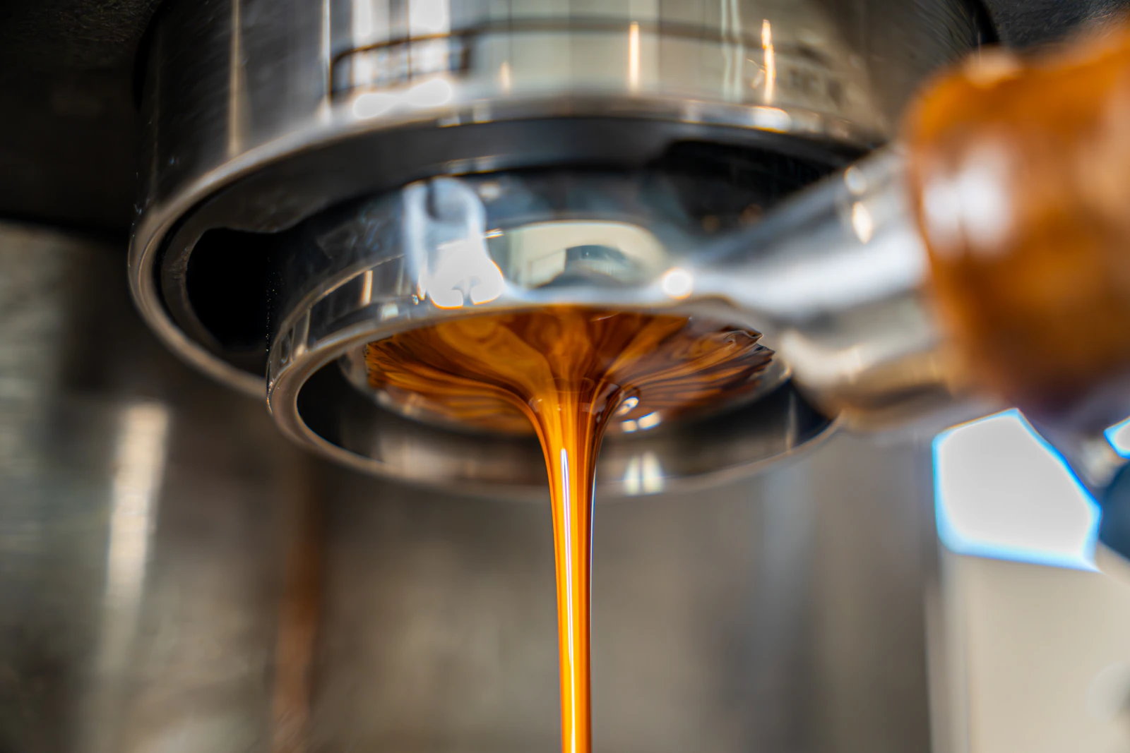 Fresh espresso pouring from a coffee machine