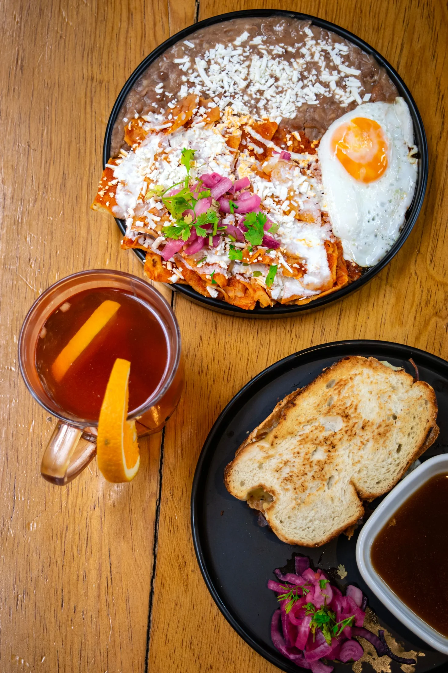 Chilaquiles with toppings at a breakfast table