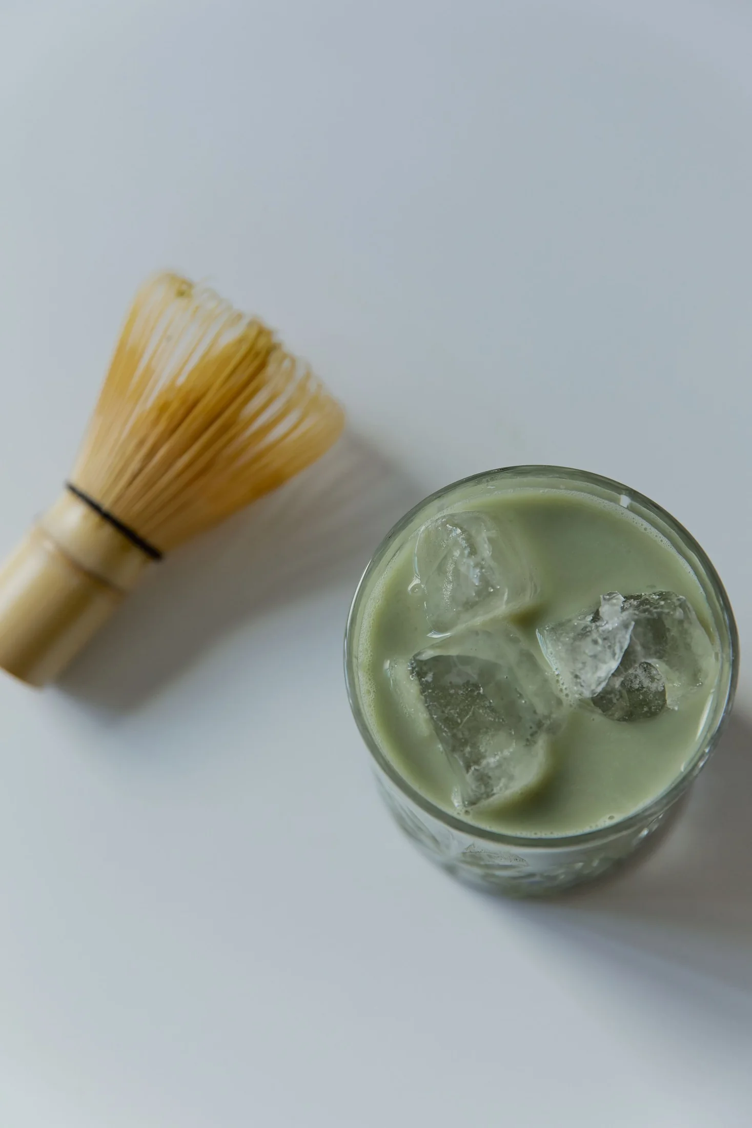 An iced matcha latte in a clear glass