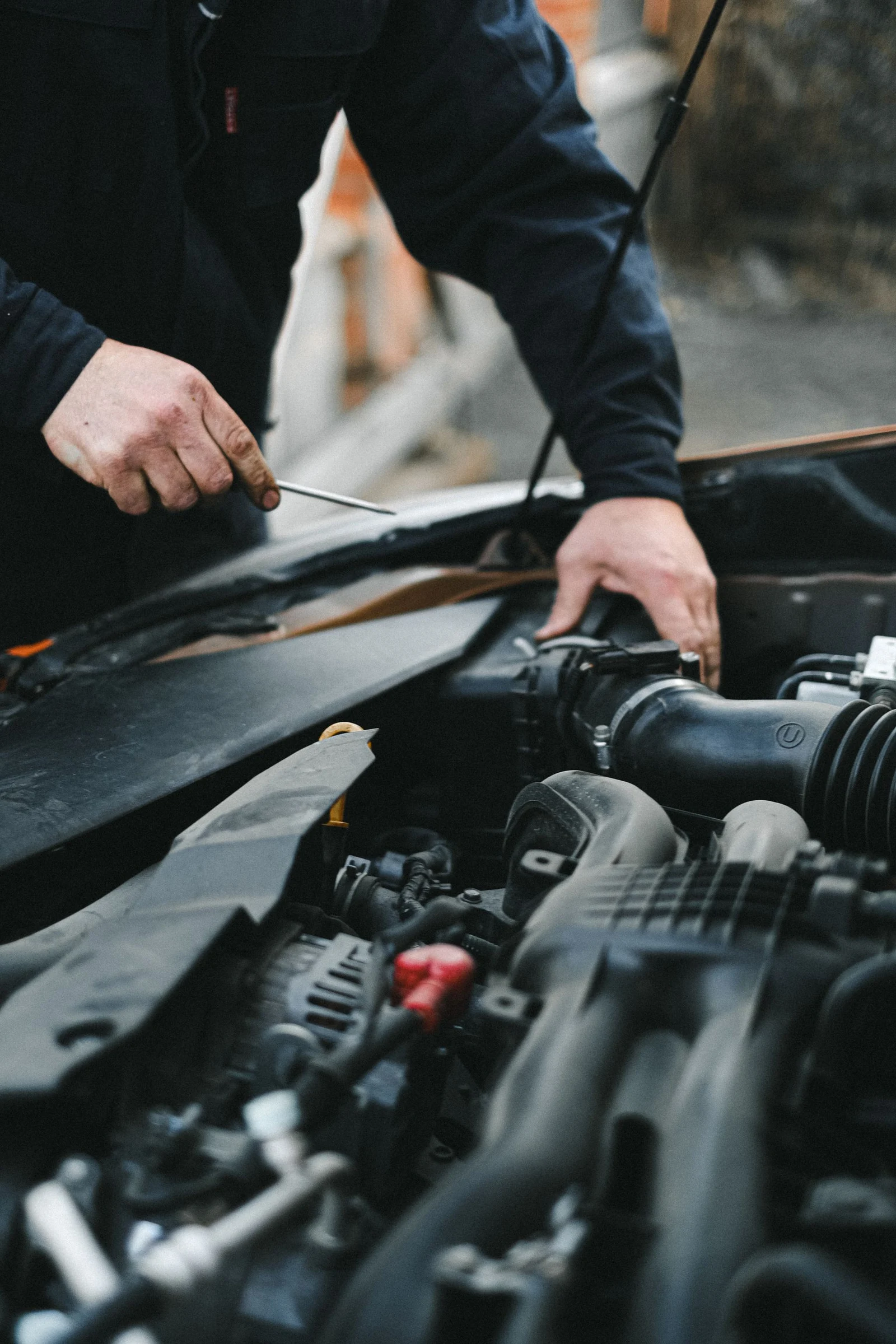 Close view of a mechanic working in an engine bay