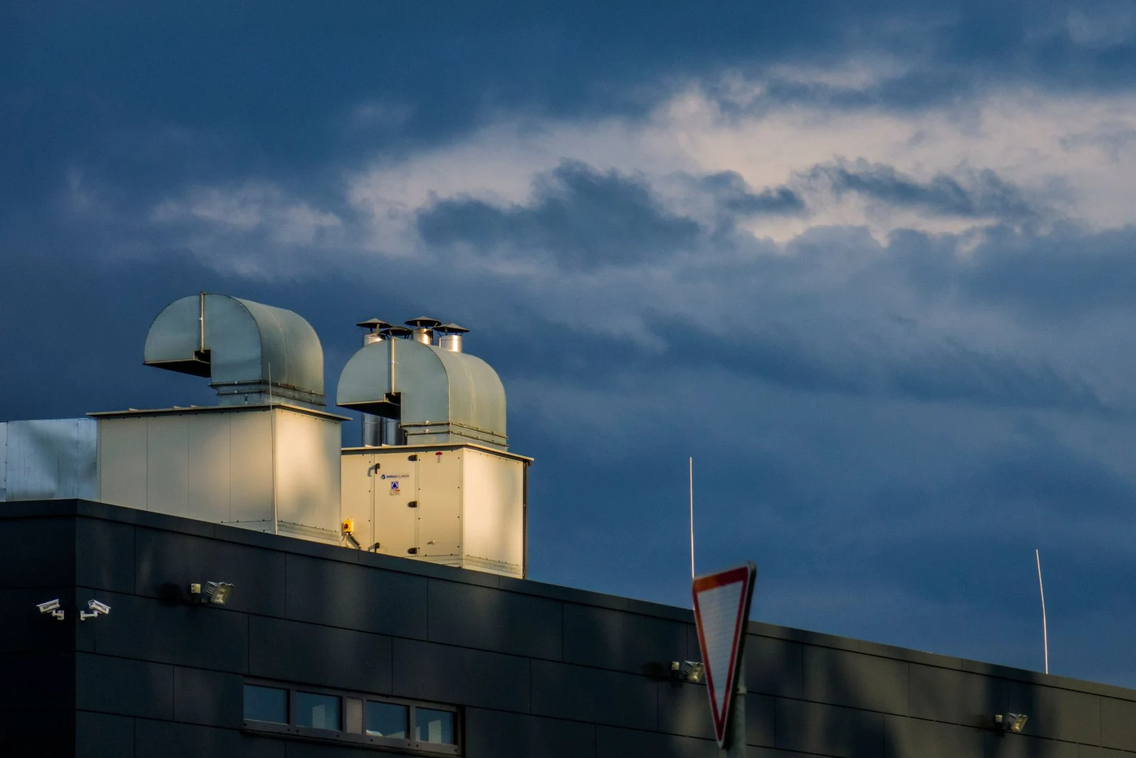 Metal ventilation ducts on an industrial rooftop