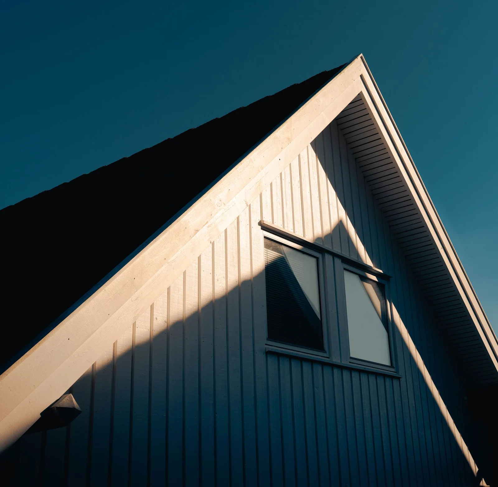 Modern pitched roof and facade in direct sunlight