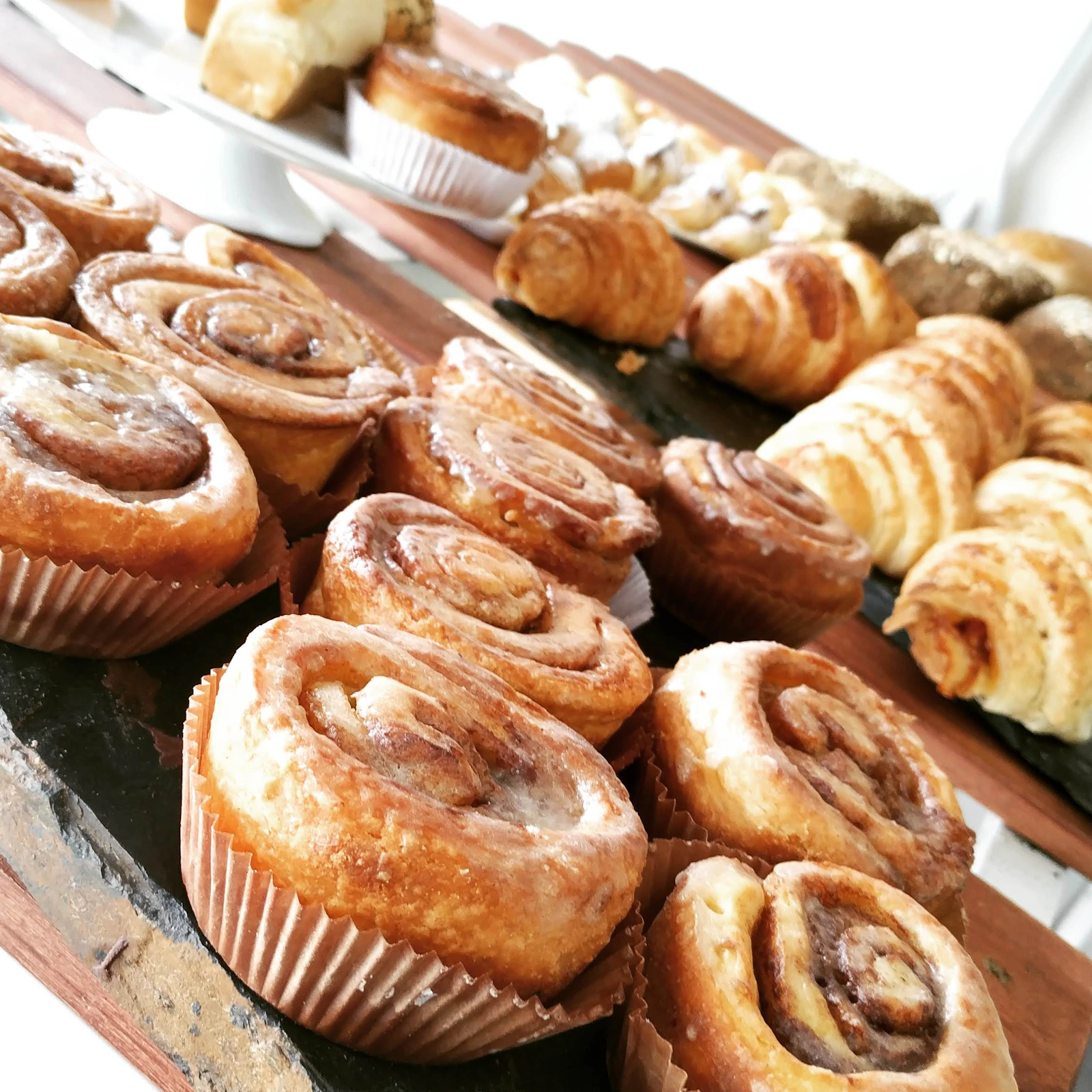 Cinnamon rolls and croissants at the pastry counter