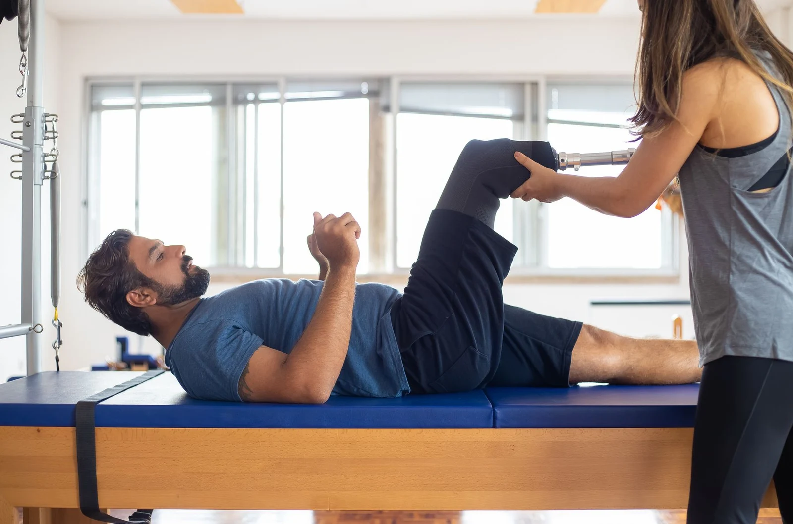 Assisted leg movement in a rehabilitation studio
