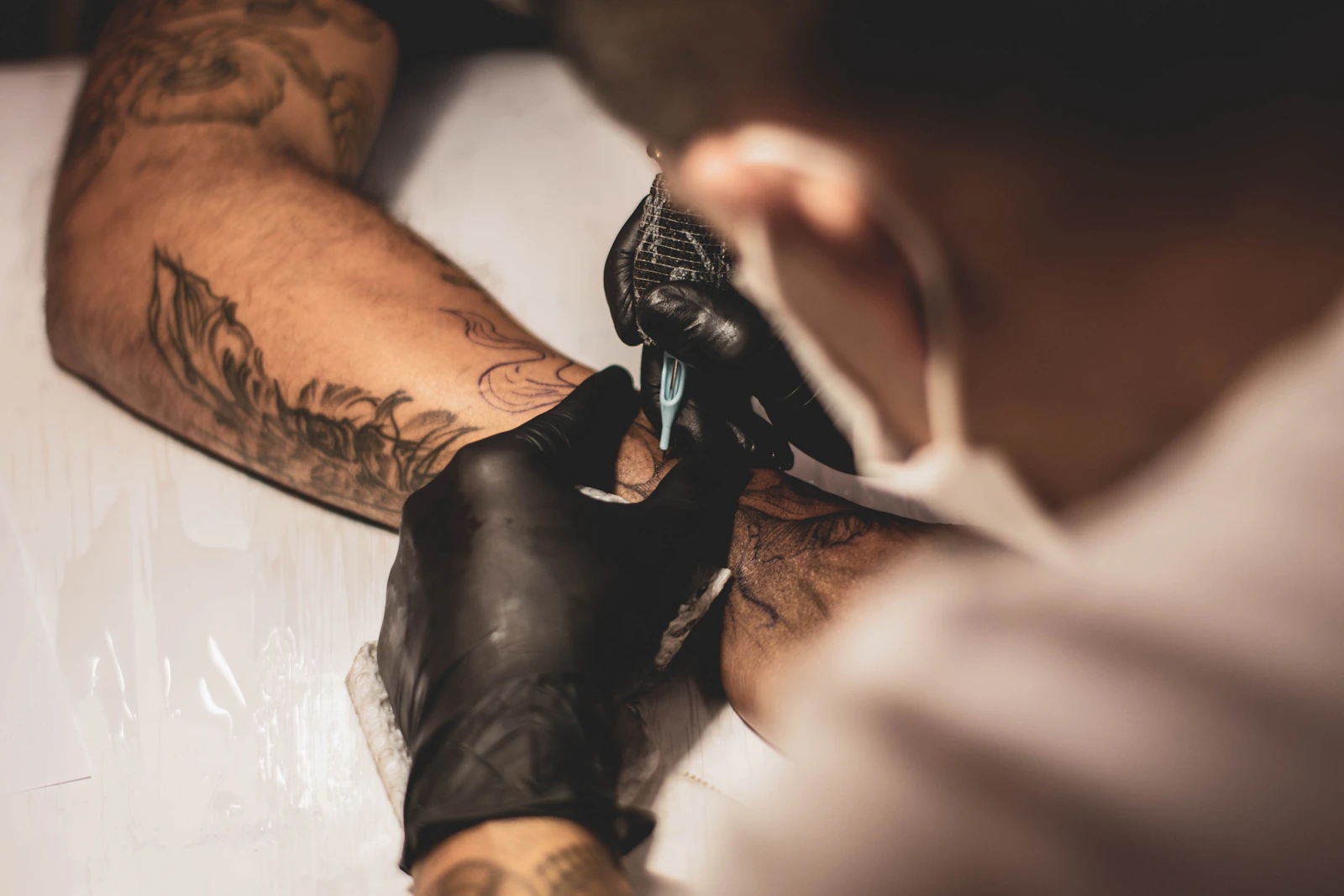 Tattoo artist working on a design